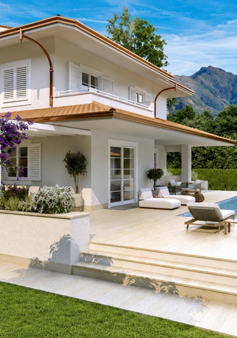 Architectural rendering of the villa and pool terrace with mountains in the background
