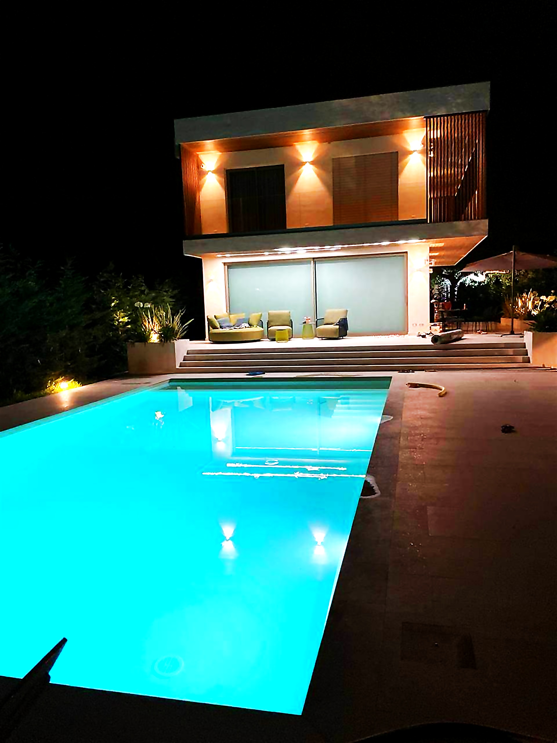 Villa and pool at night